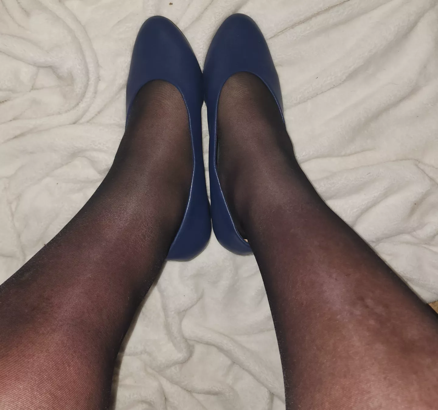 Black tights & blue pumps.