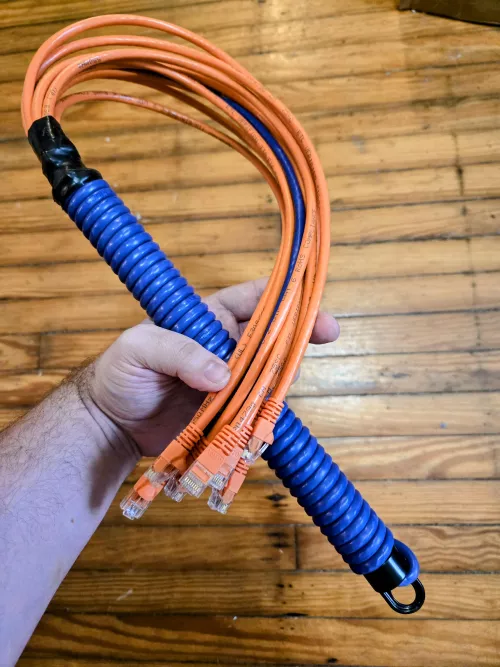 Modern Cat-O-Nine Tails, made from 5 Ethernet cables (9 ends) all cat6 10g cables with a PVC handle. 