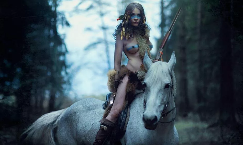 Young brave on a white horse