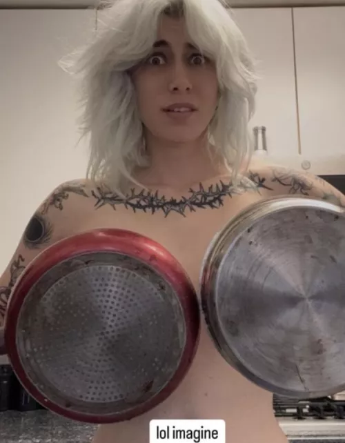 Frying pan covering her boobs 