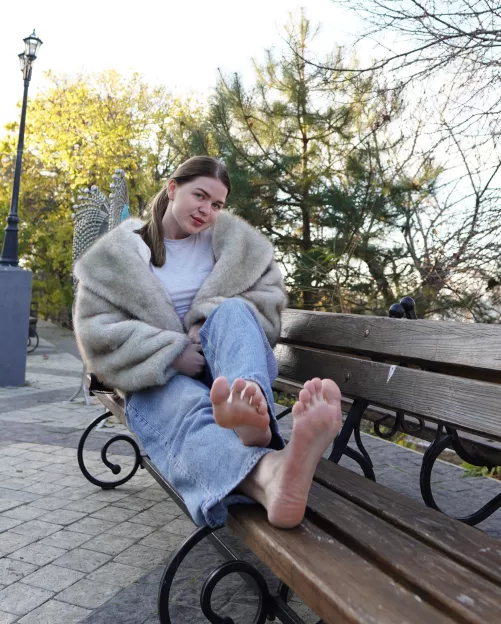 just a brunette showing off her soles in the street