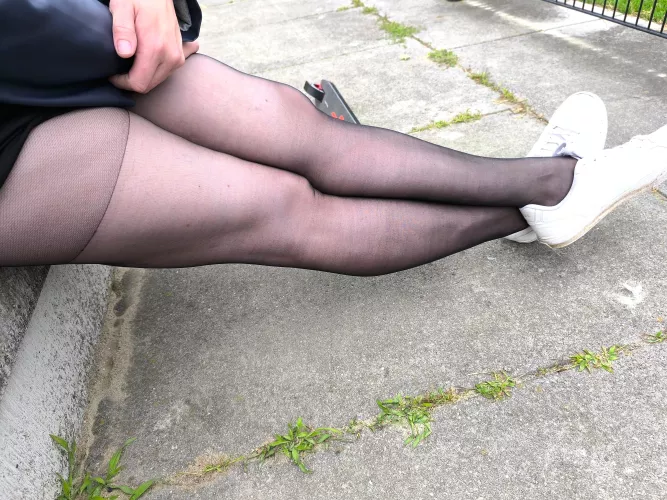 Outside in black pantyhose and sneakers 