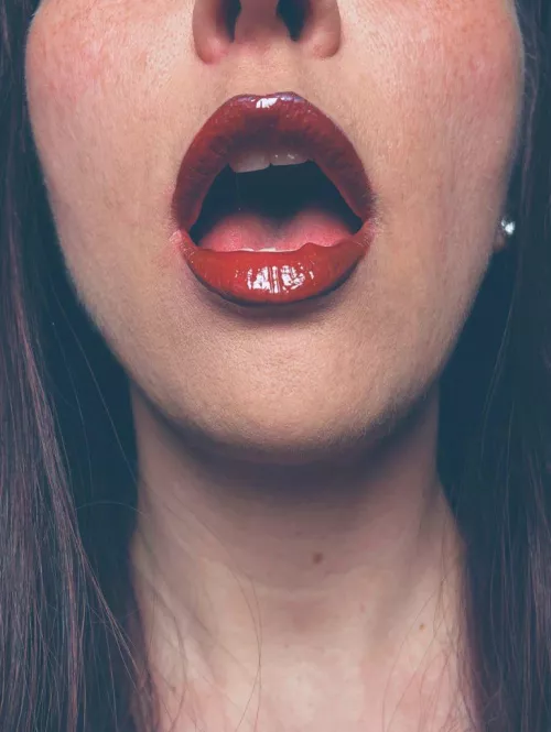 The parting of her lips hinted at an unspoken desire, igniting the air around her