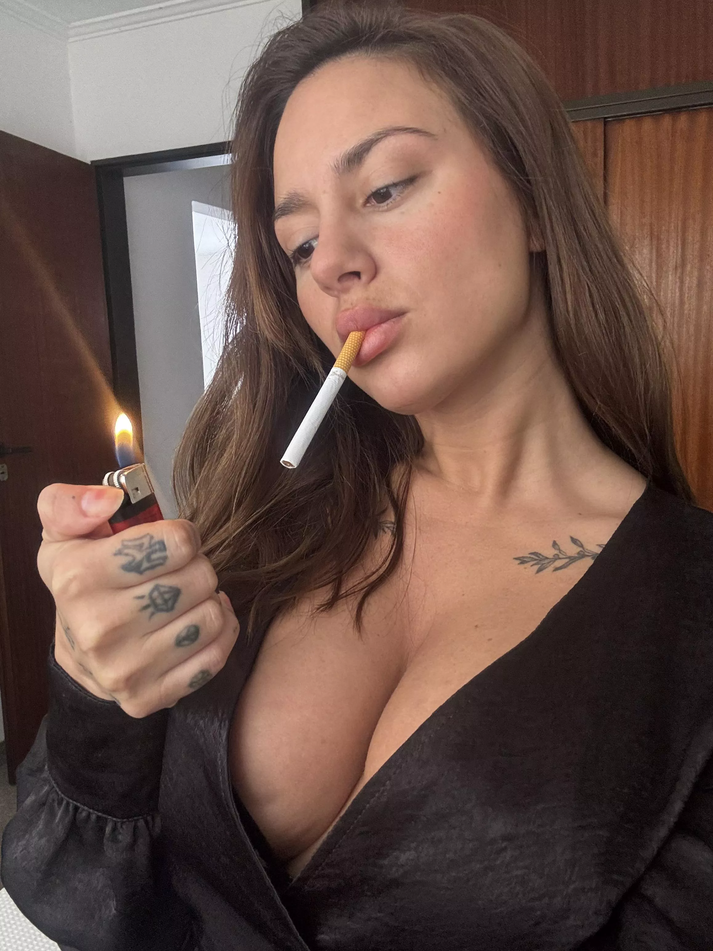 While I light the cigarette and your cock is hard, you can take off my clothes