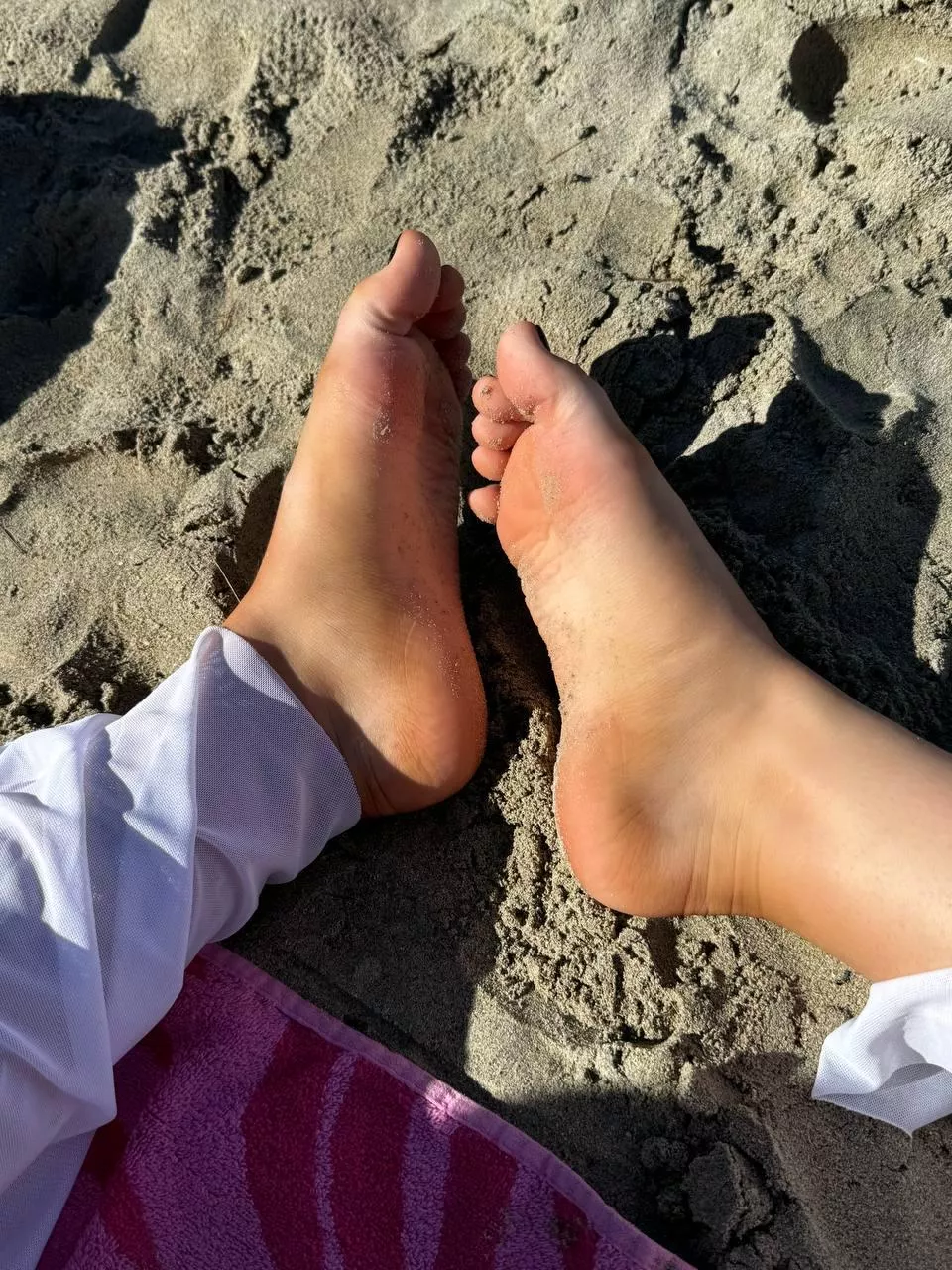 Feeling pure comfort and relaxation with my feet buried in the warm sand
