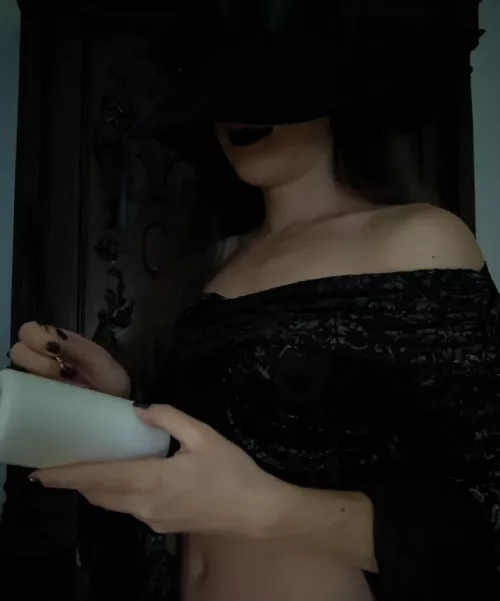 A dark witch preparing her candles