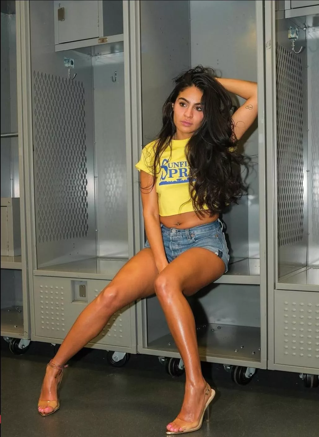 Jesse Reyes in shorts and high heels 