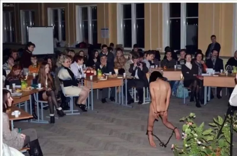 Naked, on her knees, on display for everyone to watch and enjoy. This is a whore in her natural place...