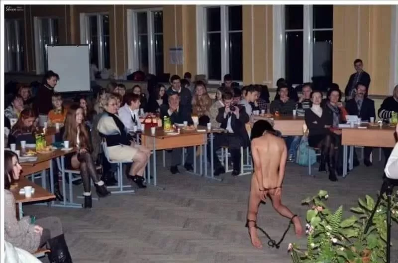 Naked, on her knees, on display for everyone to watch and enjoy. This is a whore in her natural place...