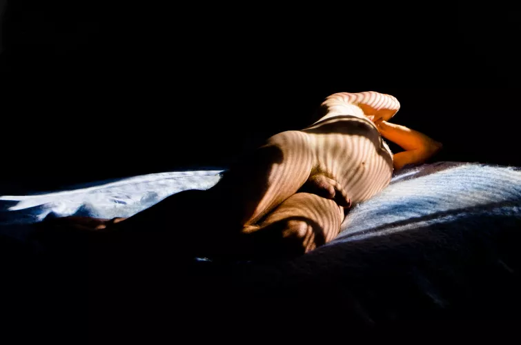 nude male in striped sunlight
