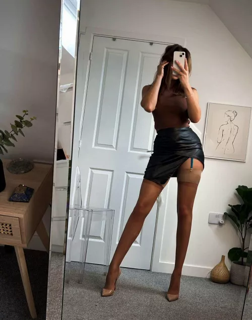 Sexy stockings, belt, Skirts and heels. What more can you ask