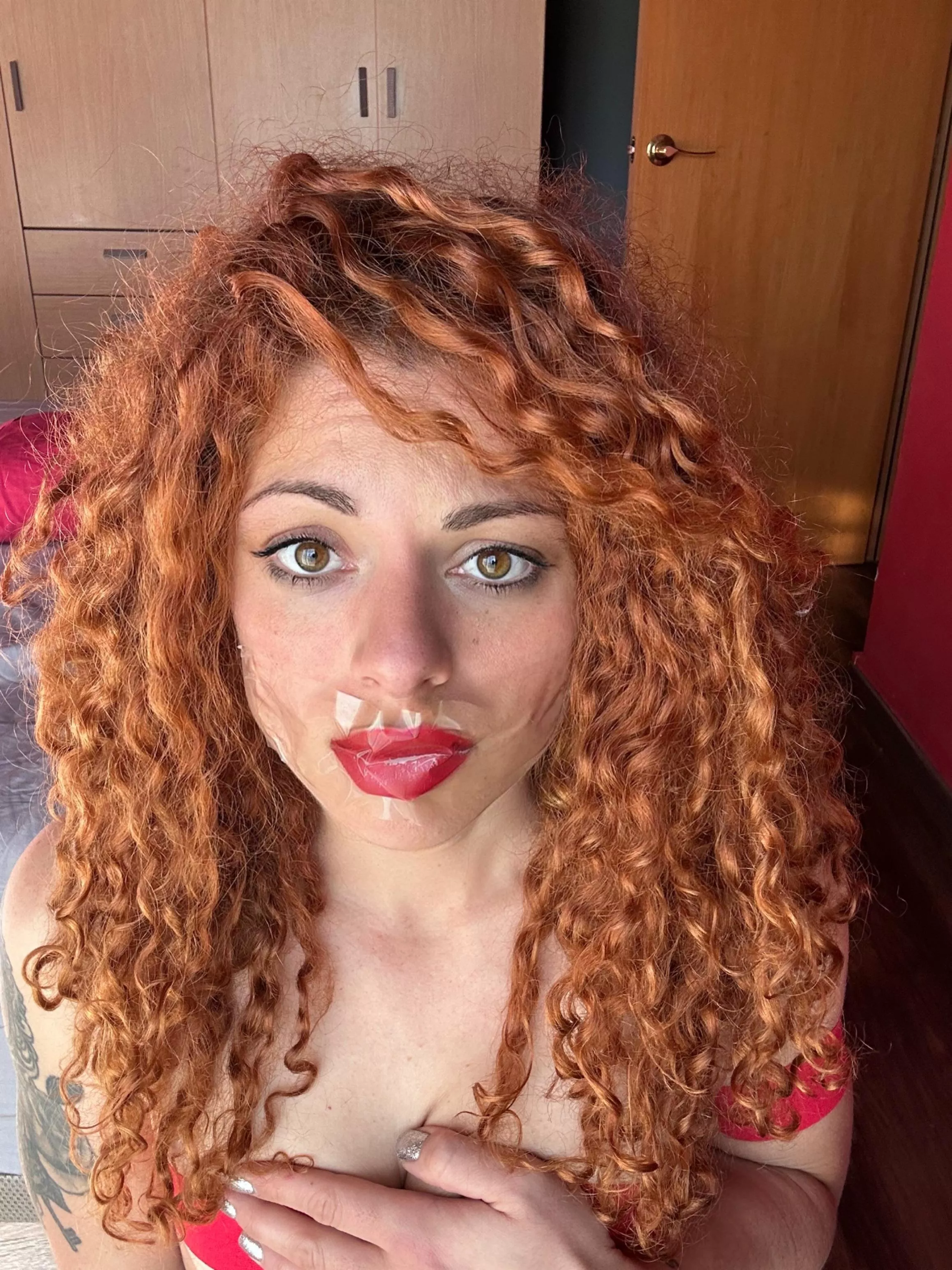 Clear tape on red lipstick