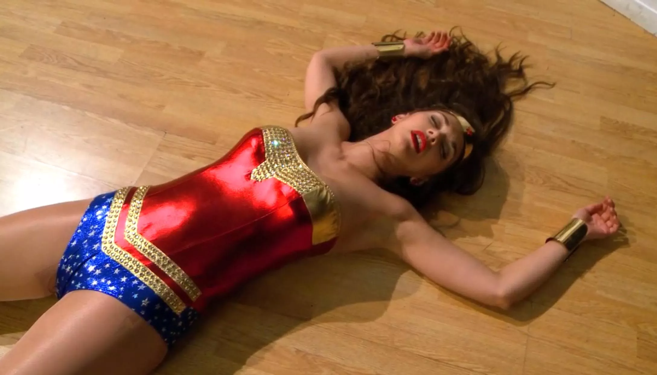 Wonder Woman Cosplay is defeated and unconscious 