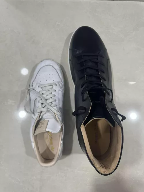 The white shoe is a size 15. Guess the size of the black shoe.