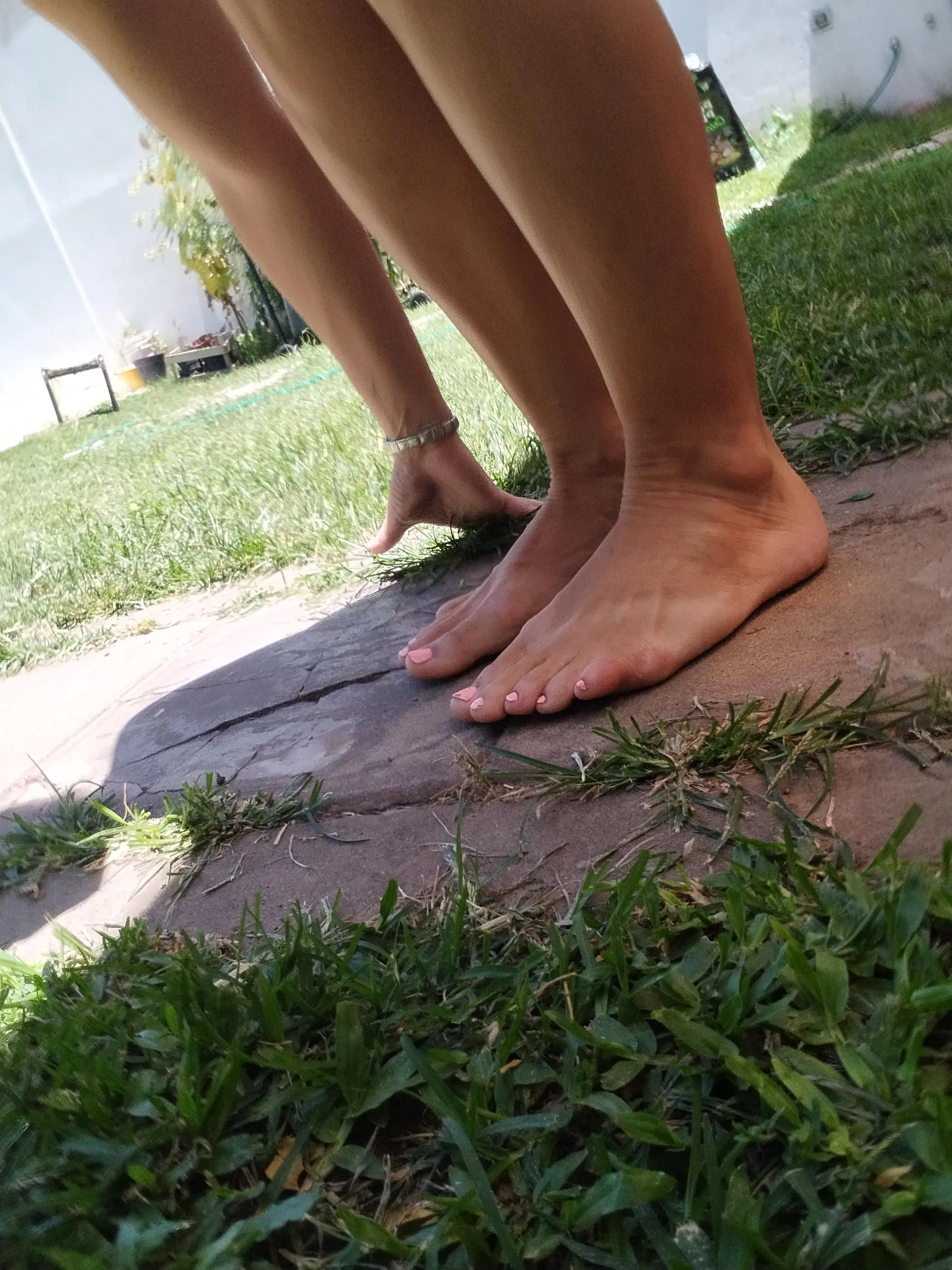 I enjoy watering and walking barefoot on the grass.