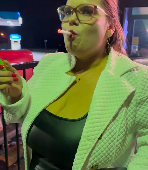 Smoking in my leather dress outside the bar