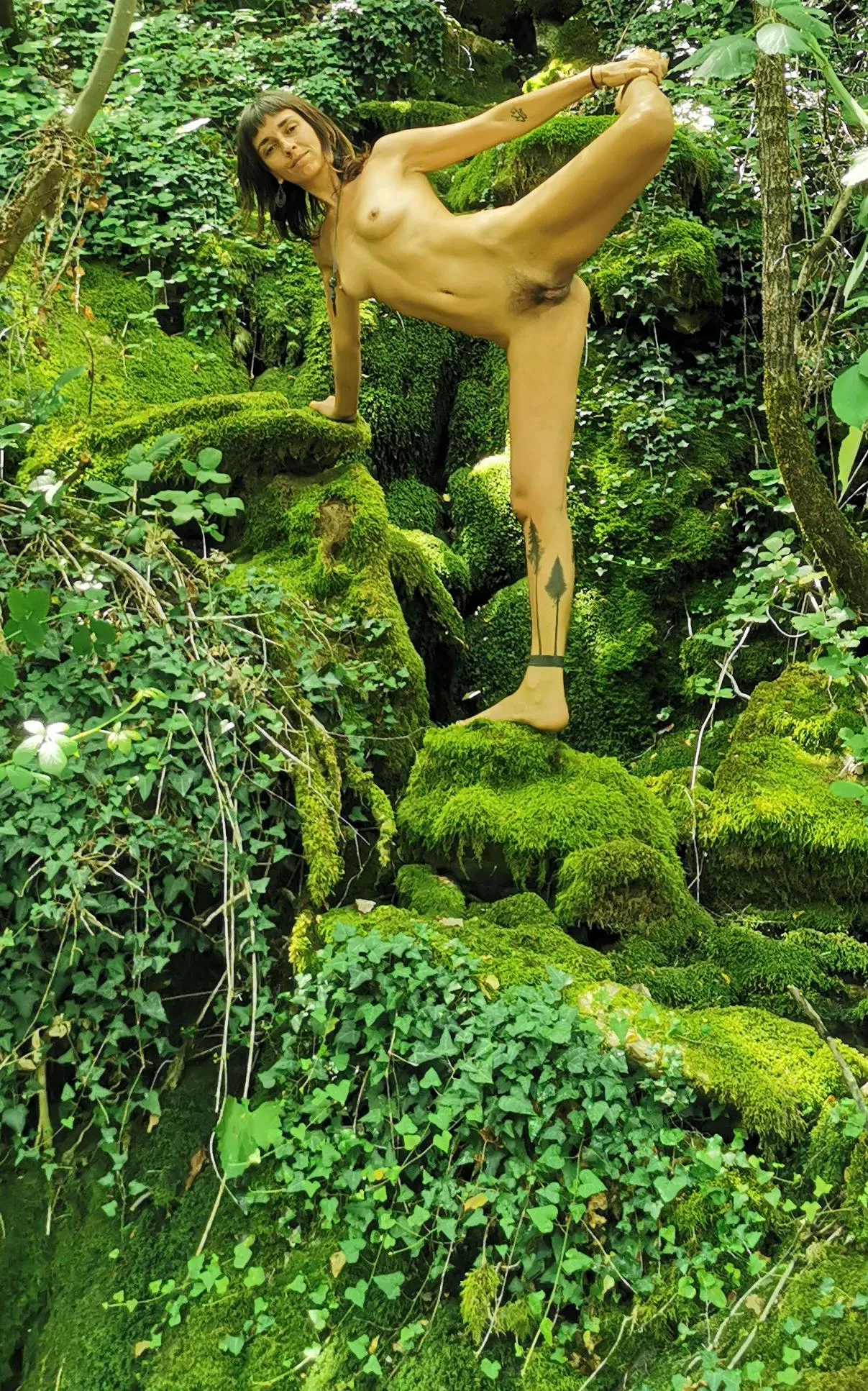 Stretching my tired legs after hiking naked in the woods