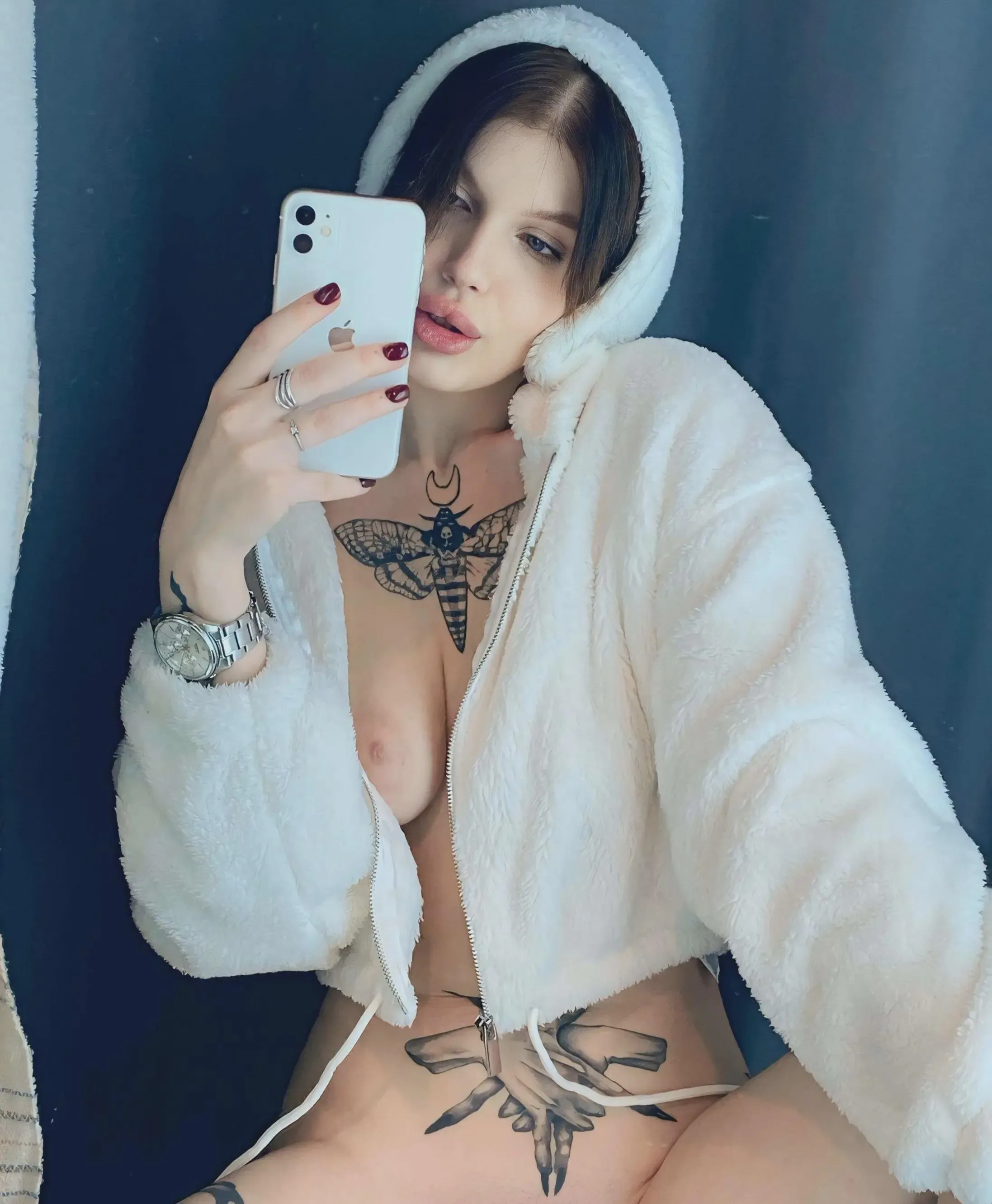 horny brunette taking selfies in the mirror