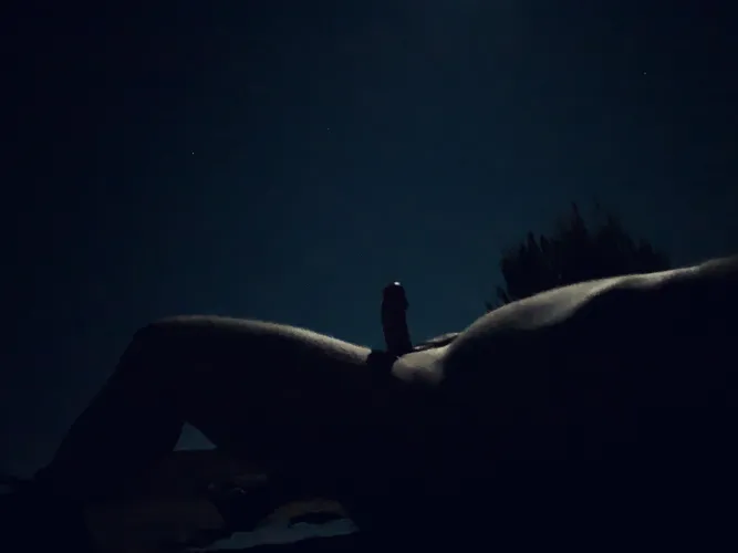 Outside, under a full moon