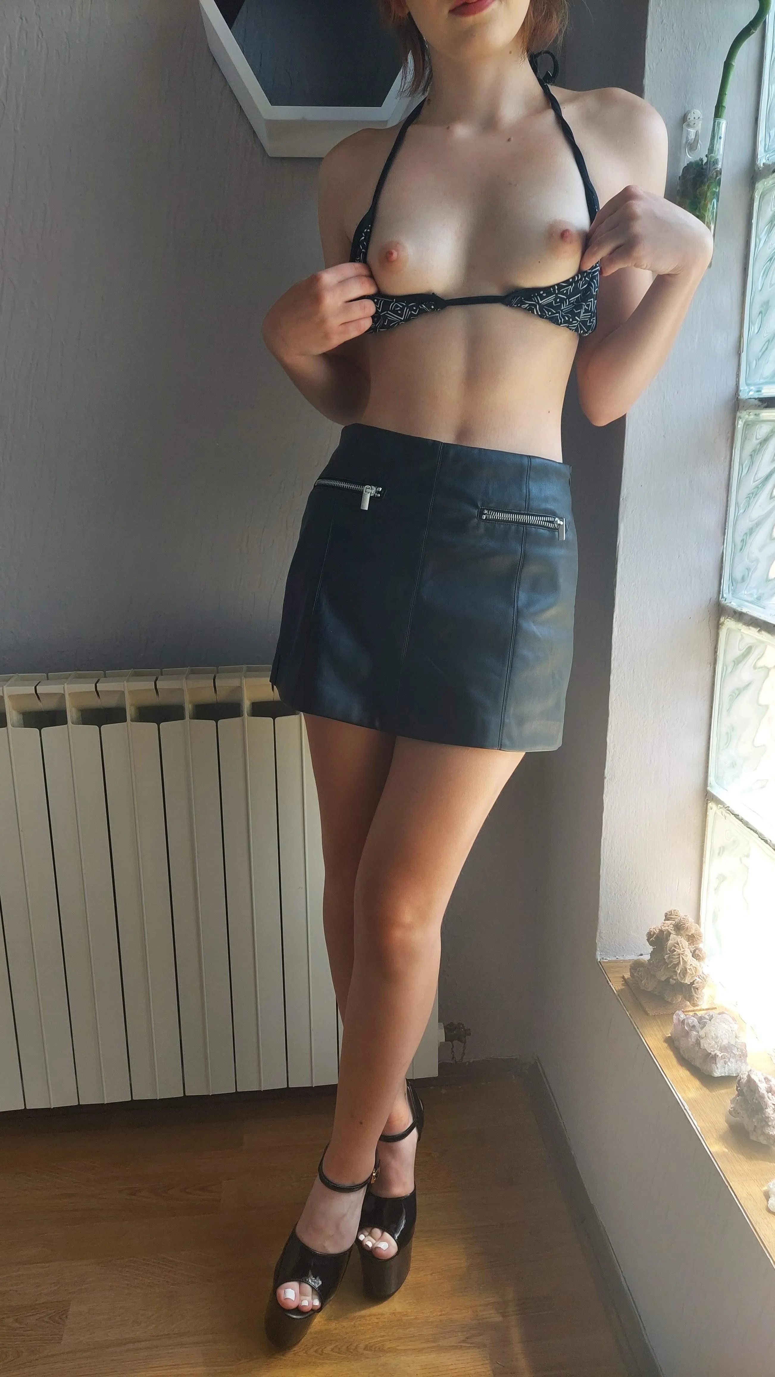 Shiny heels and leather skirt