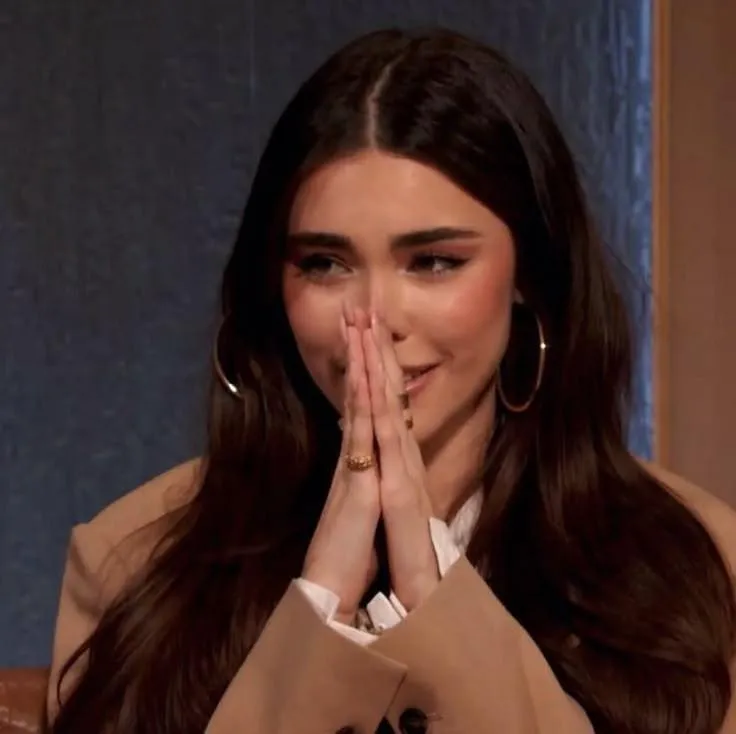 What is she reacting to?