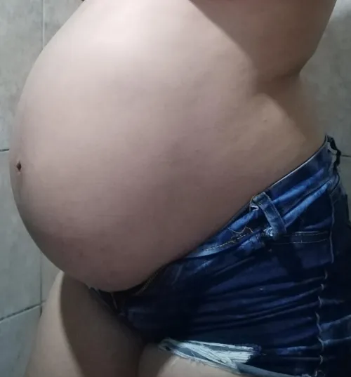 My pregnant belly out in the open, would you play with it?