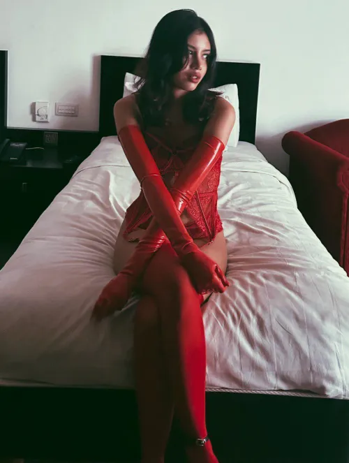 Every outfit becomes irresistible when paired with sleek, glossy latex gloves