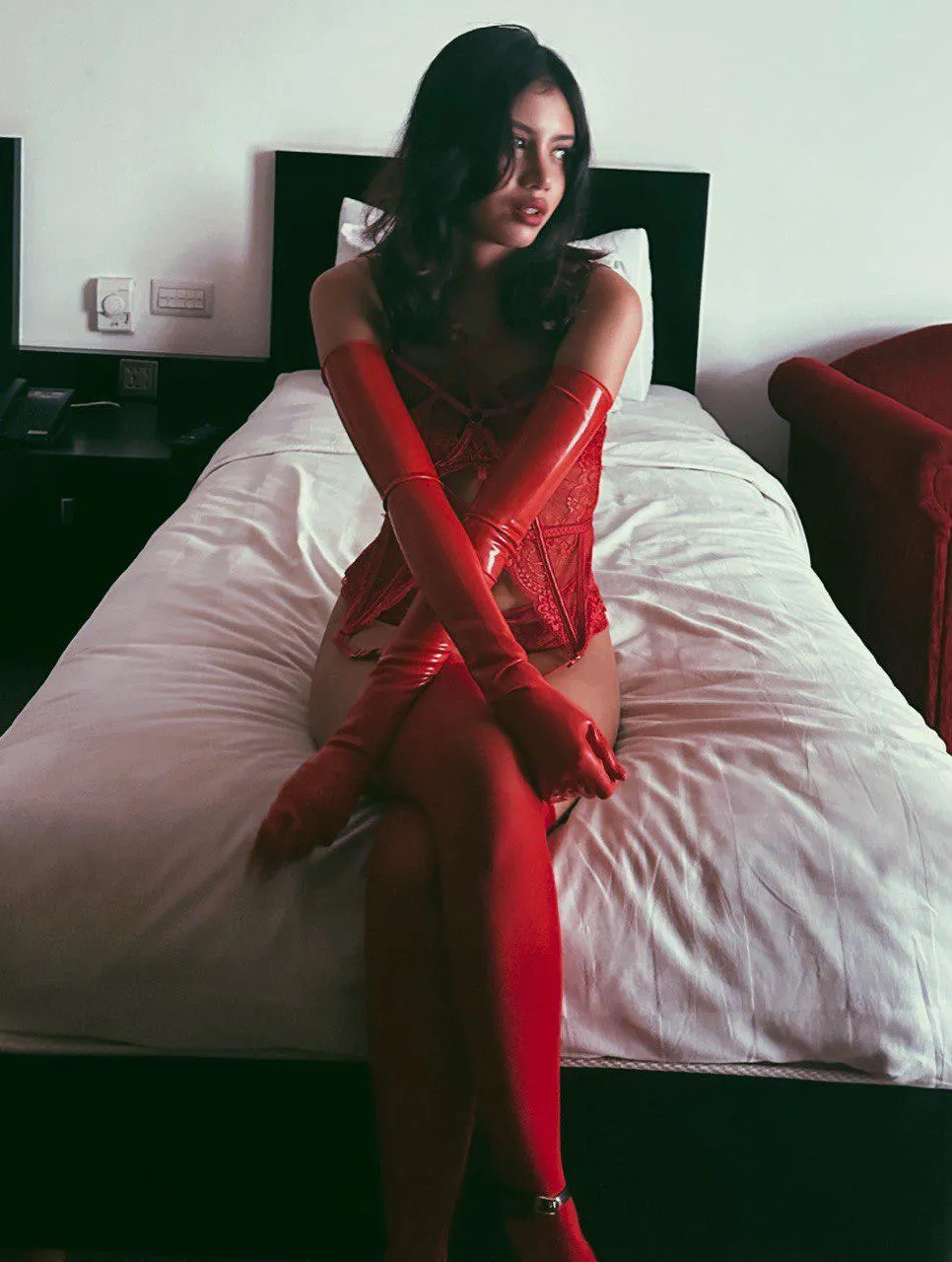 Every outfit becomes irresistible when paired with sleek, glossy latex gloves