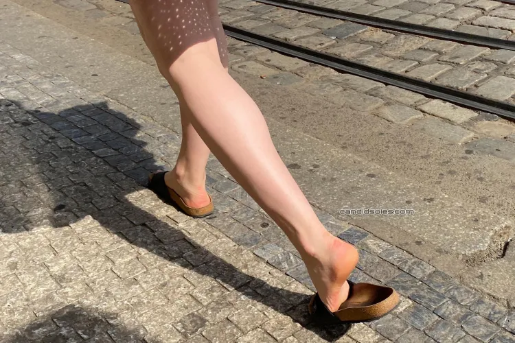 Pretty young woman with sexy feet in birks