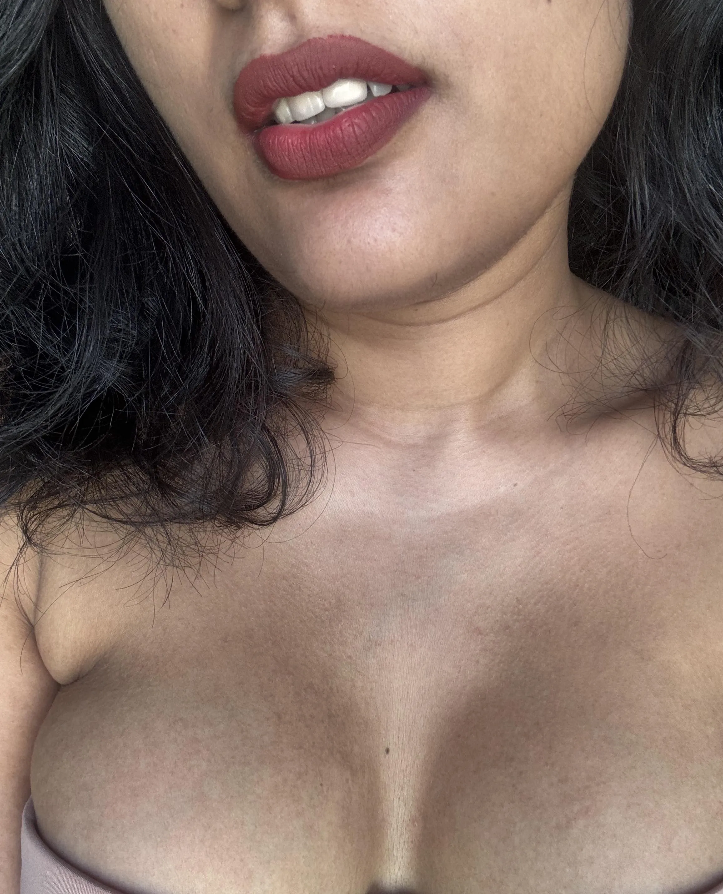 Can you really resist her red lips and cleavage?