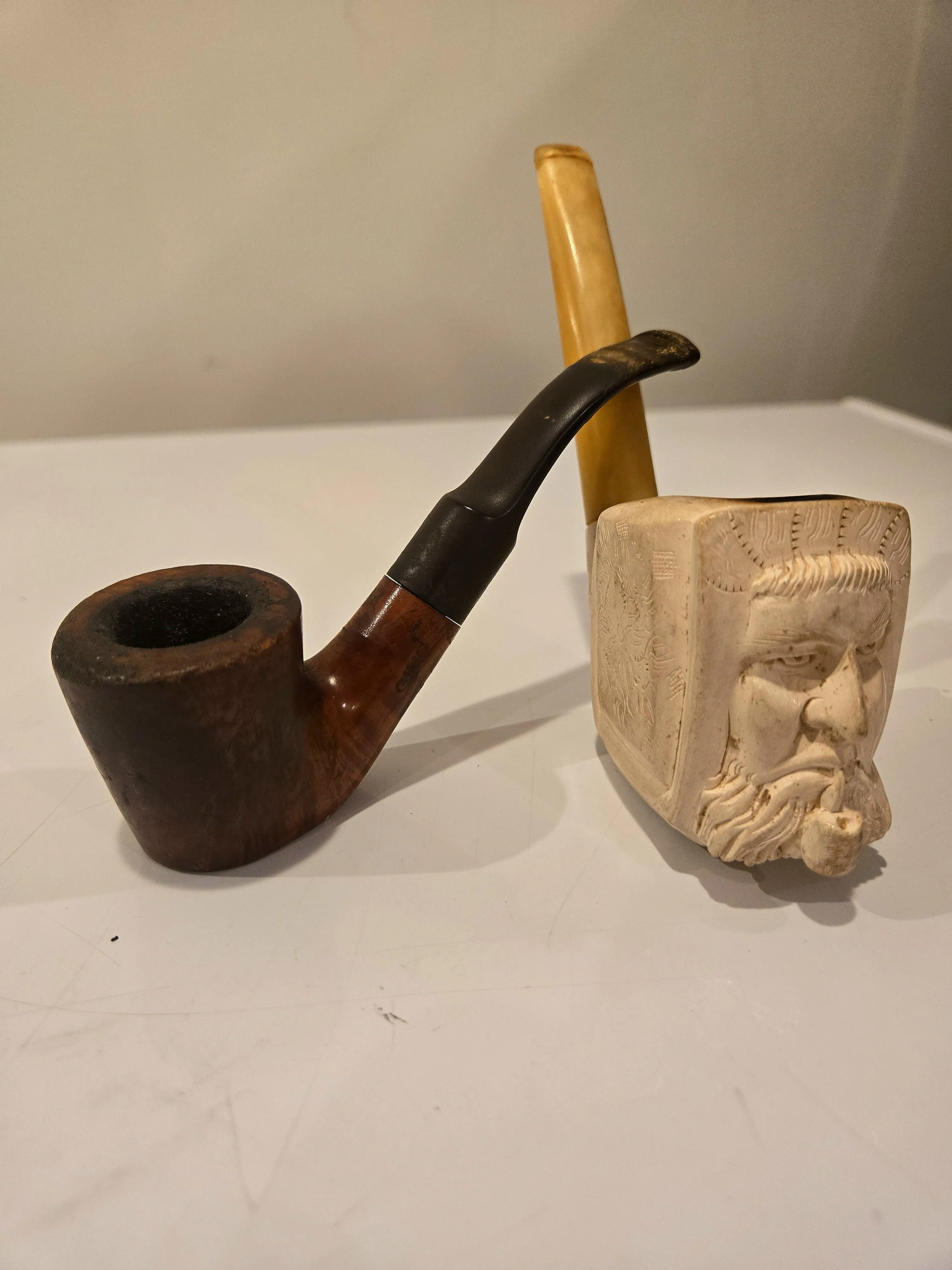 Grandpa's pipe on the left, and great grandpa's meerschaum on the right. Does anyone know where to get a replacement stem for the Gino on the left?