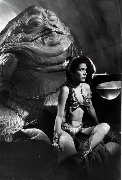 She sits quietly before her Master like a good girl waiting for her next command