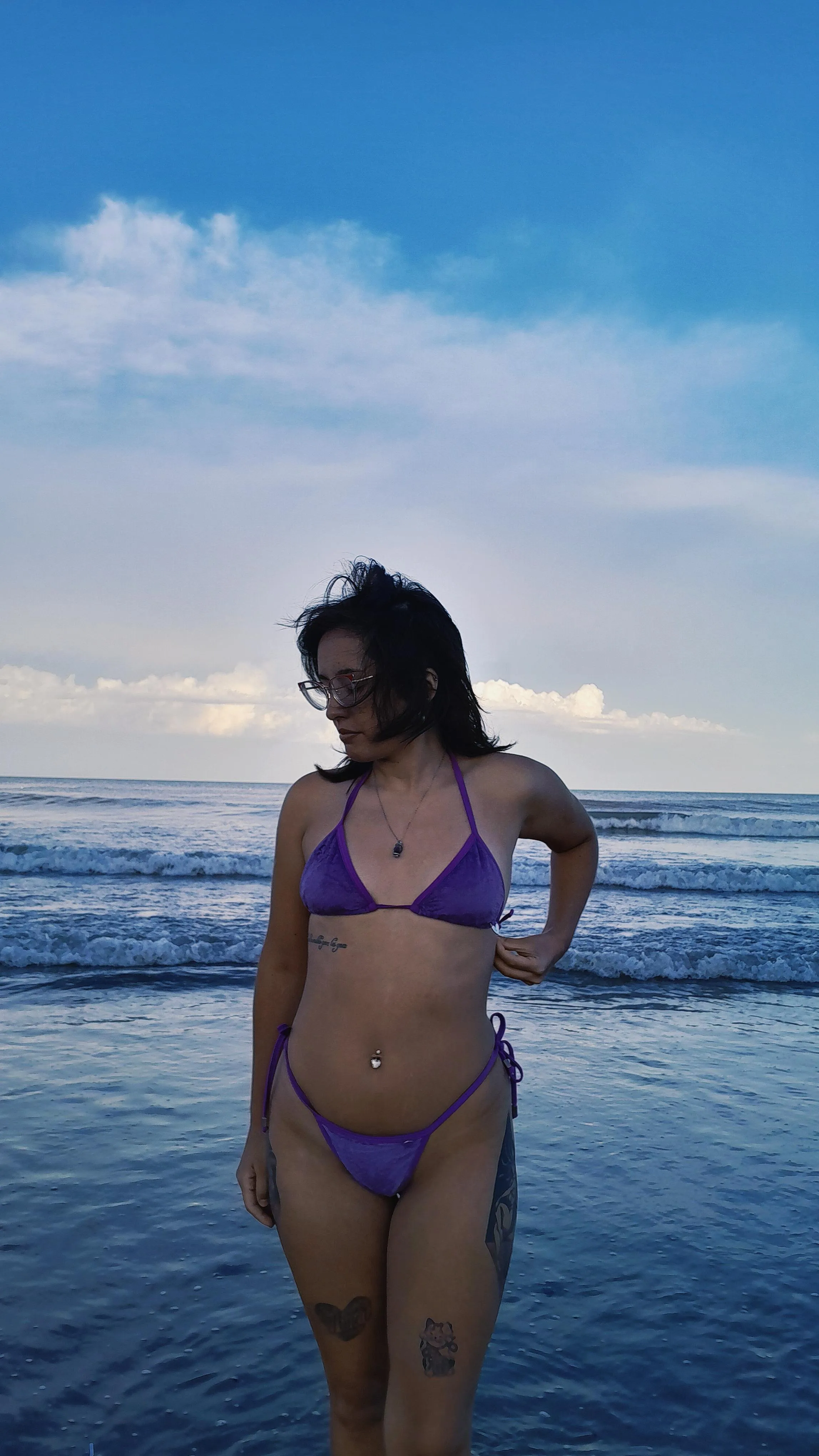 Showing off my tattoos and my tiny bikini in the sea 🌊