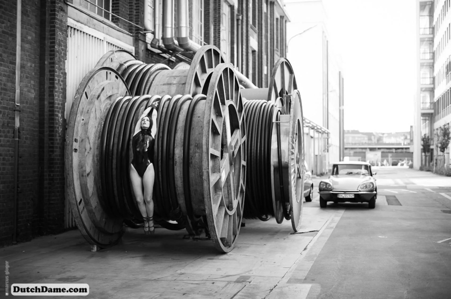 In latex and tied to a cable reel