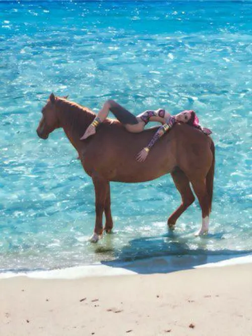Some bareback horse riding in the water with bodypainted beauty Christallia.