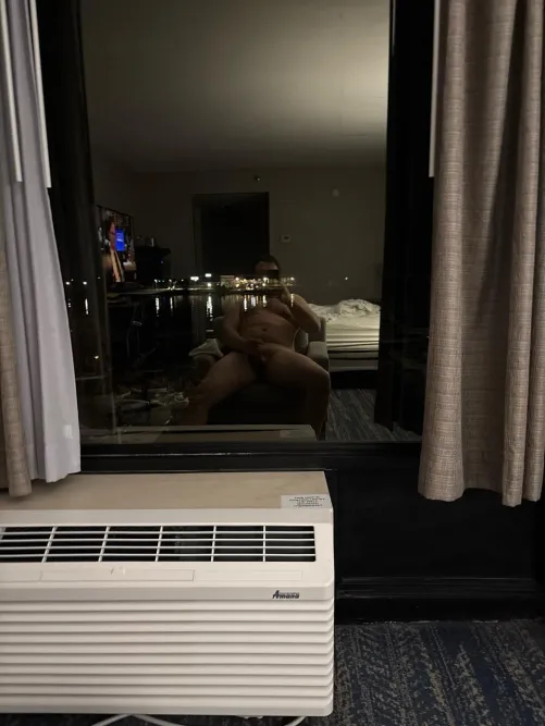 Stroking in front of my hotel window