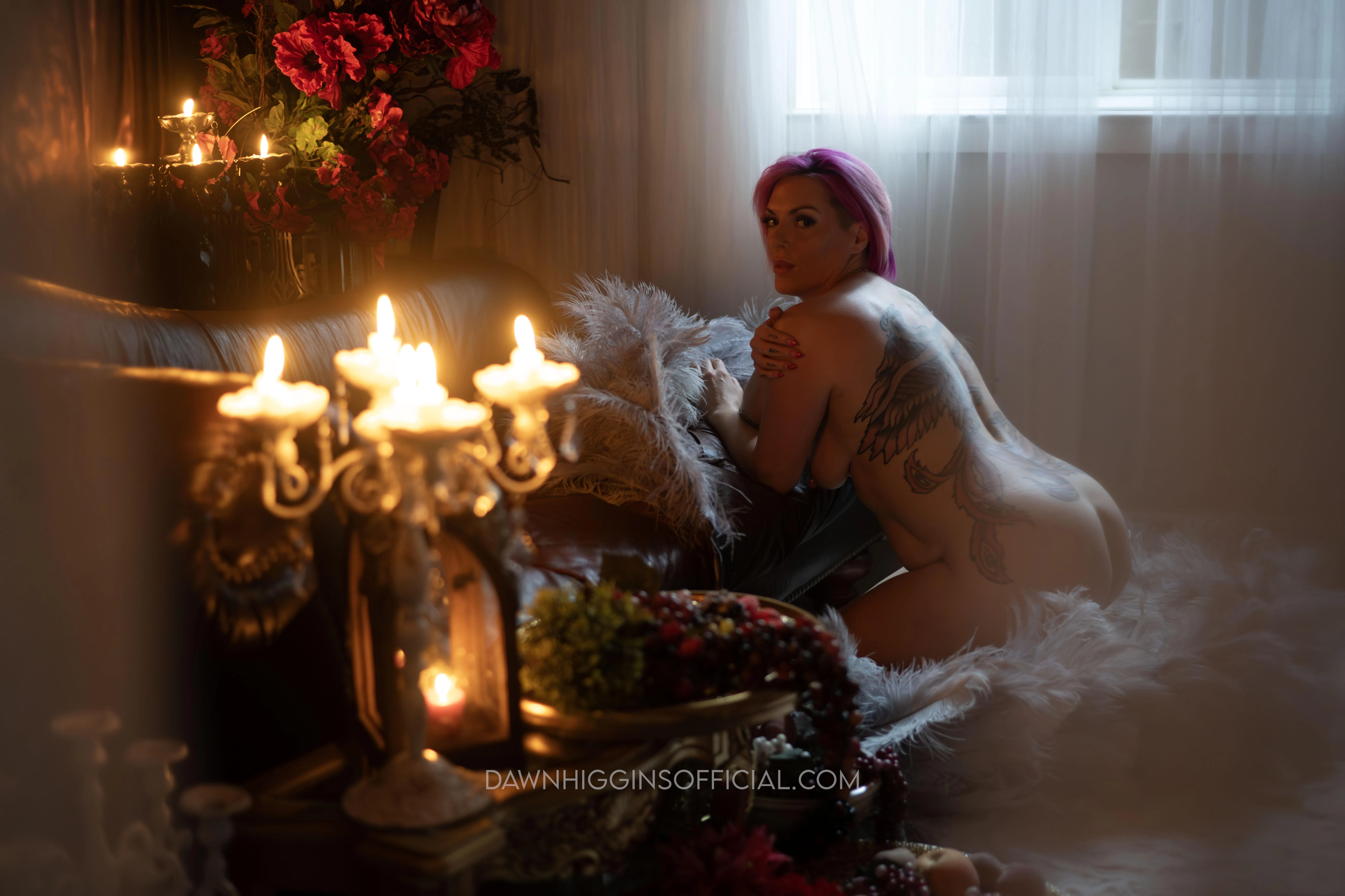 Glowing mature tattooed woman