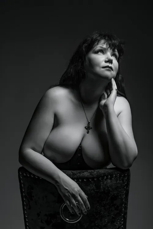 A study in light and shadow, a portrait of poise. A moment of profound reflection.