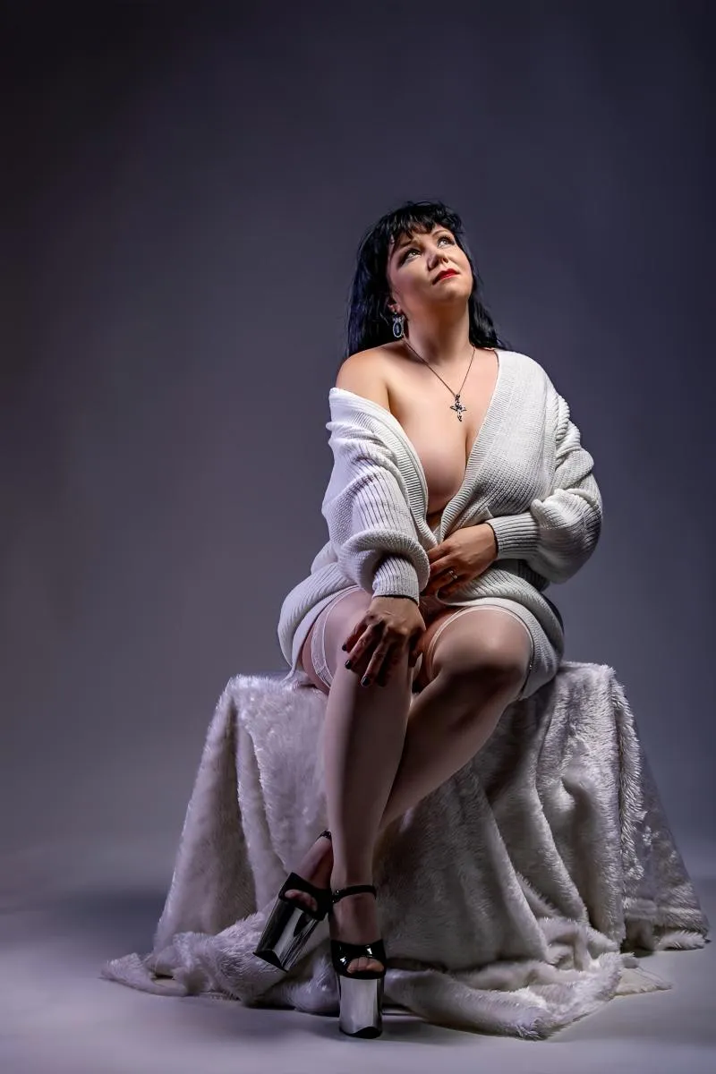 The soft glow of the studio, highlighting curves and angles. A study in subtle allure. A moment suspended in time.