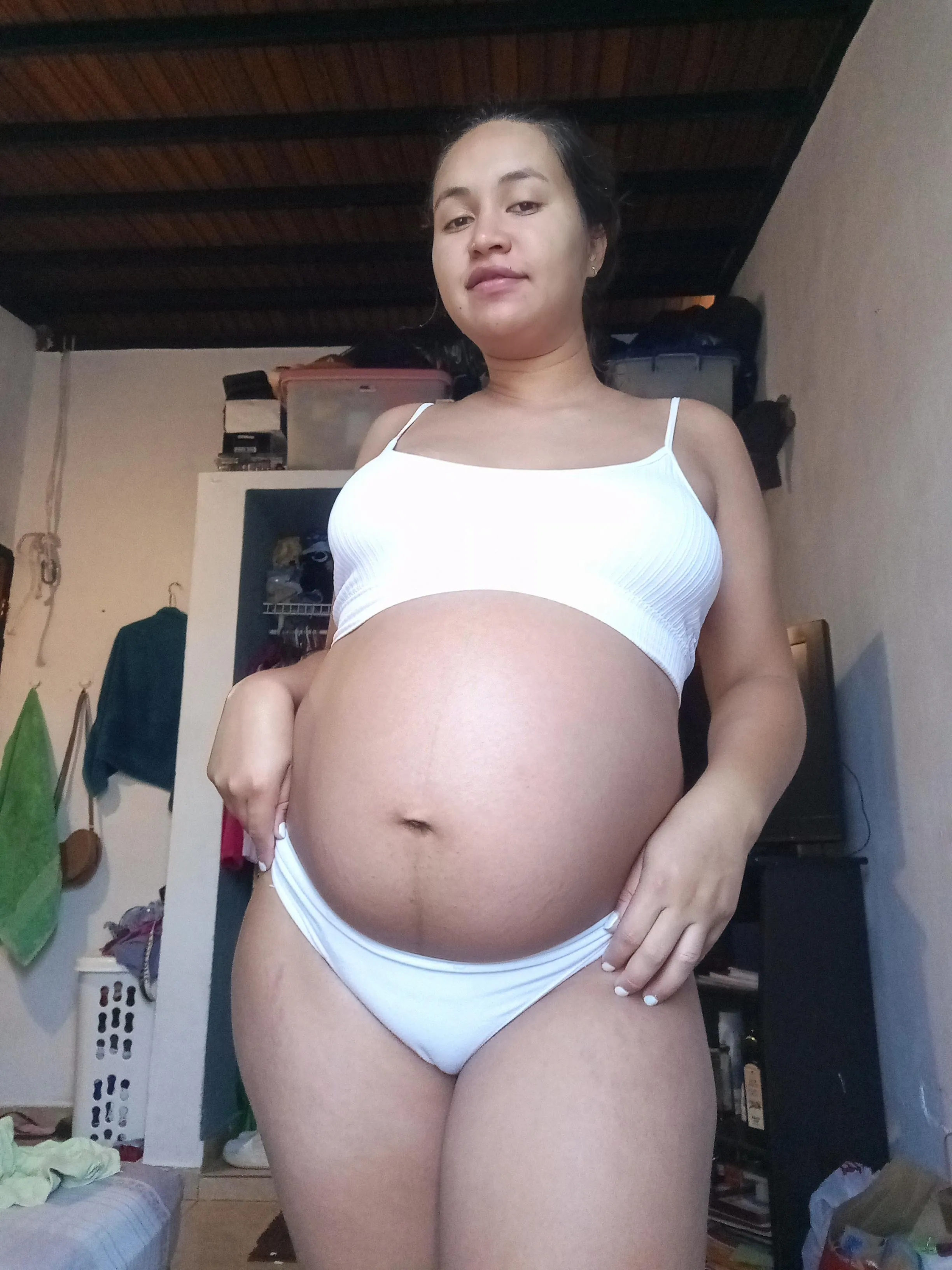 Pregnancy suits me so well, would you like to rub your penis while looking at my belly?