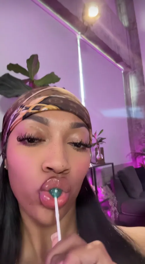 Angel sucking on a lollipop