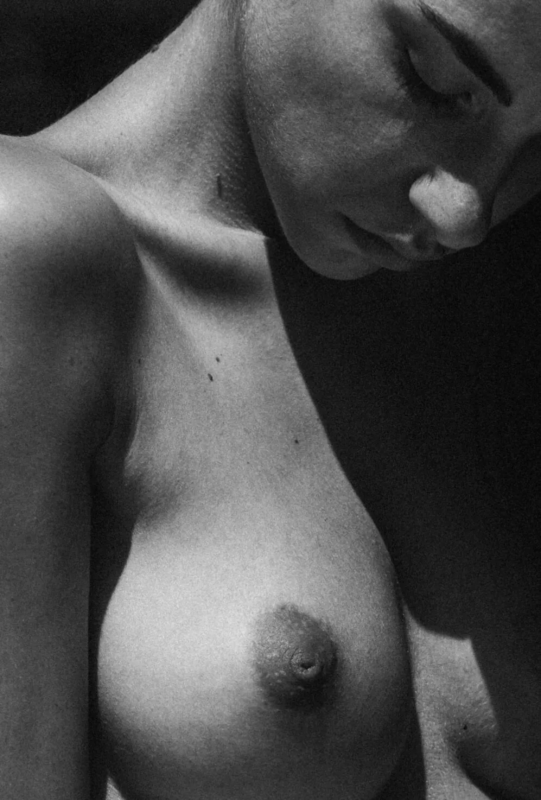 Shadows dance and play / On skin, a lover's soft touch / Secrets light gives way