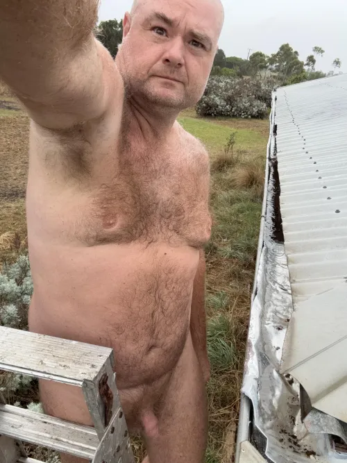 Fixing the guttering in the rain