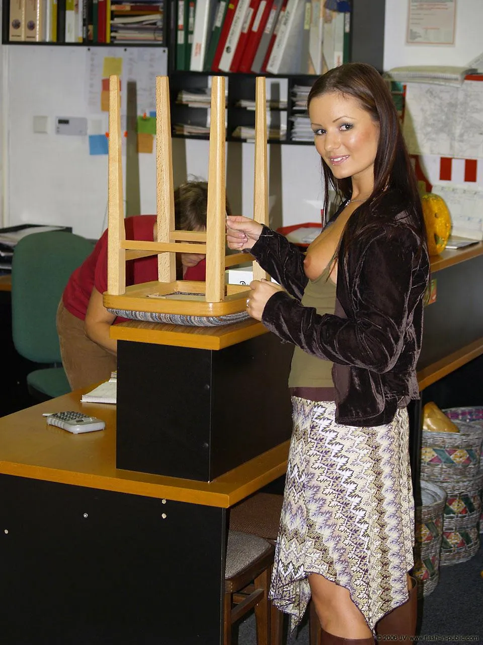 Scenes from AltBoobWorld : This lady is buying a stool from a used furniture warehouse.  There's many bargains to be found here!