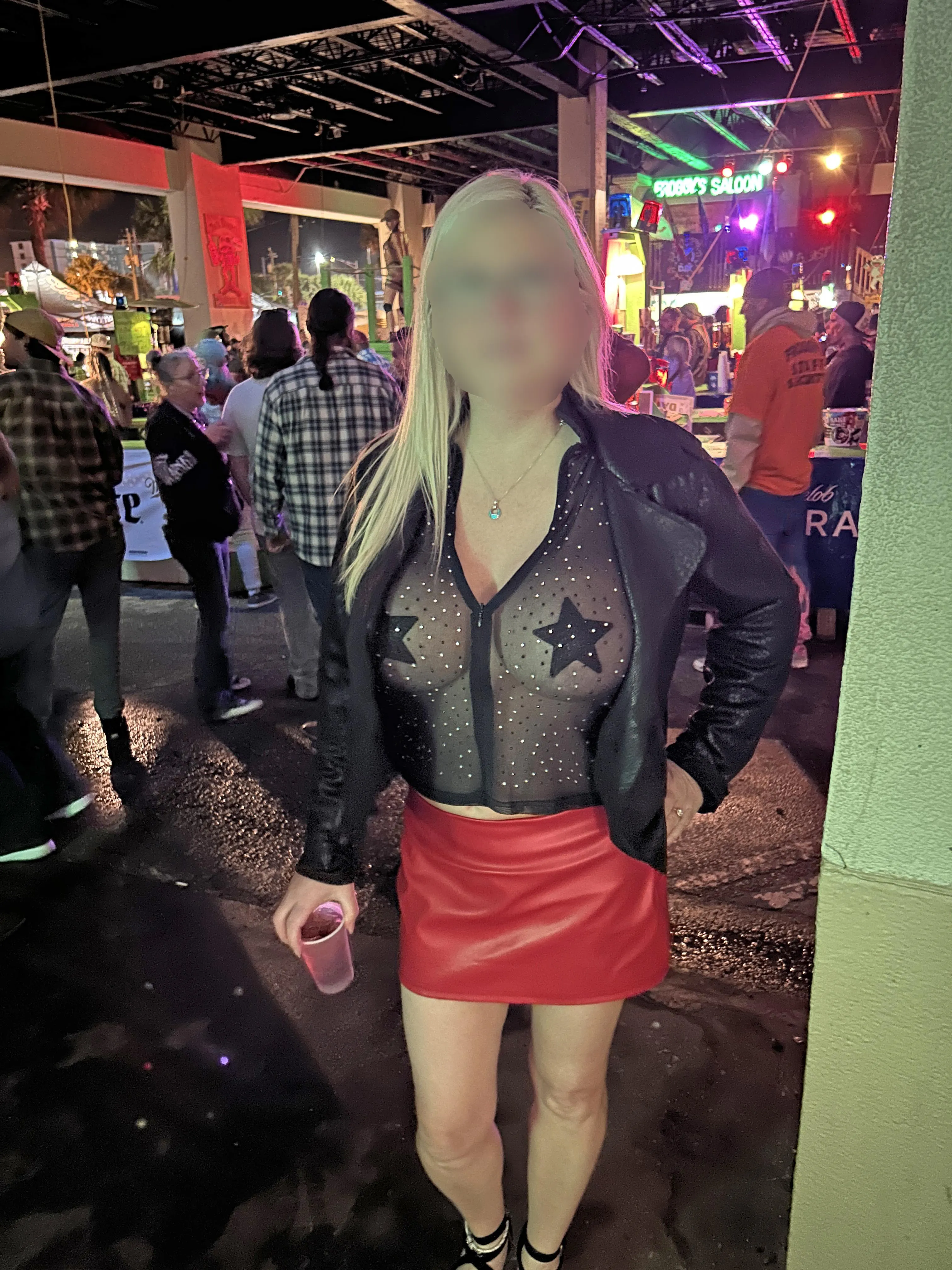 Teasing on Main street at Daytona Bike Week in my tiny red leather microskirt and sheer Black Blouse [image]