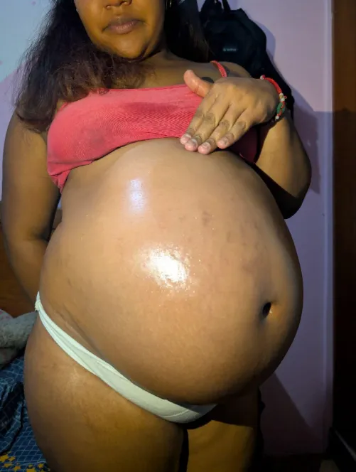 A lot of oil in my pretty pregnant belly