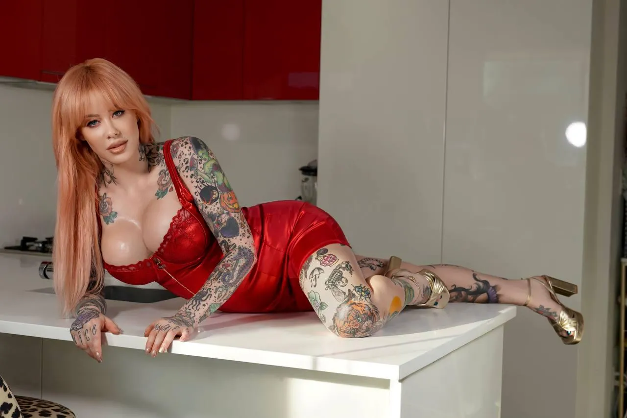 Shiny red dress with matching shiny gold heels.