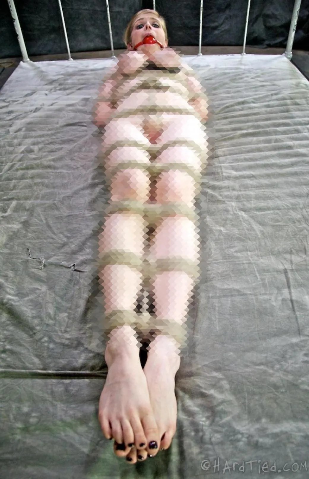 She's been here like this for quite a while... Why don't you worship her feet to make her feel more comfortable!