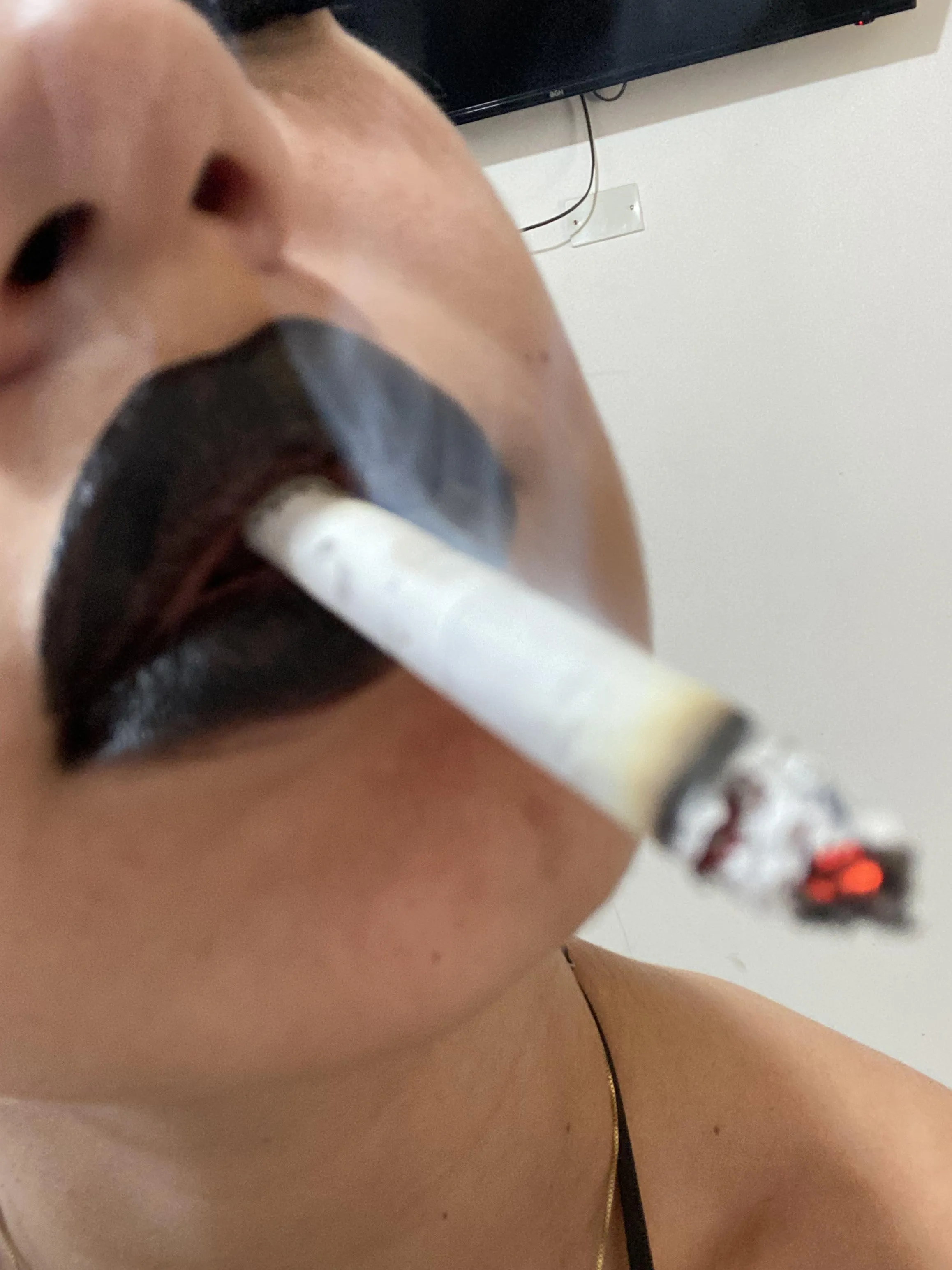 Black lips covered with smoke
