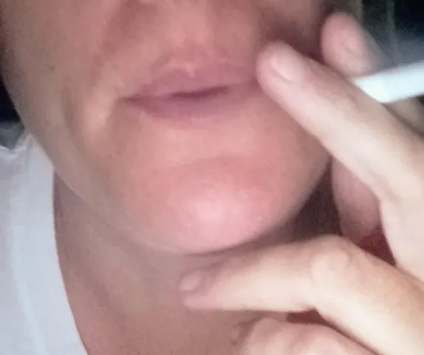 Enjoying a cigarette at night